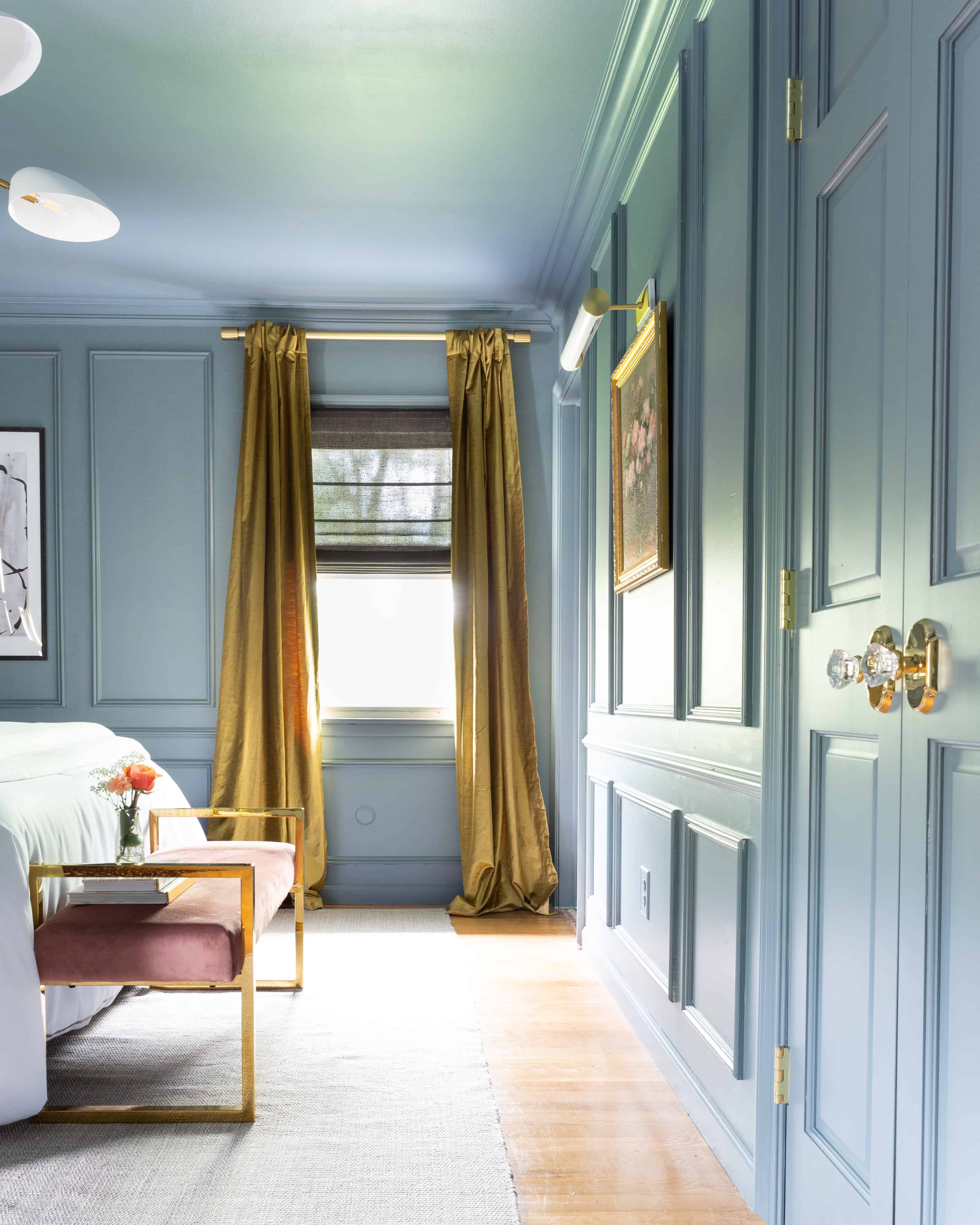 modern-blue-bedroom-makeover-molding-trim-gold-curtains