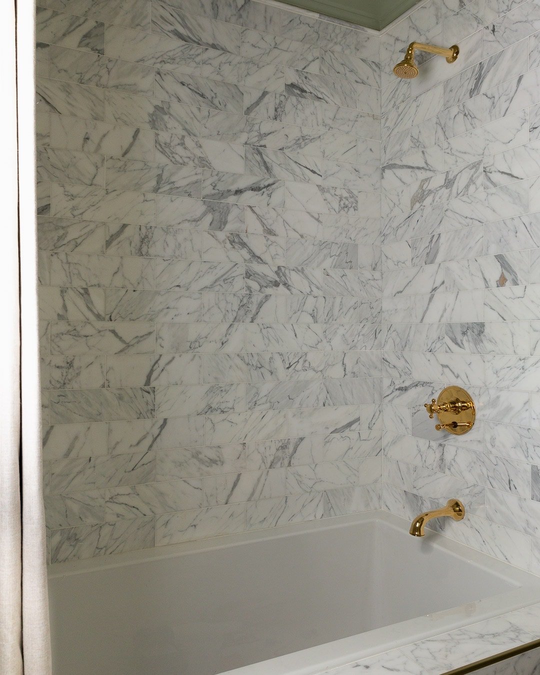 gold-calacatta-marble-shower-tile