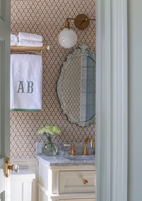 bathroom-makeover-ideas-wallpaper-monogram-towels-brass-hardware