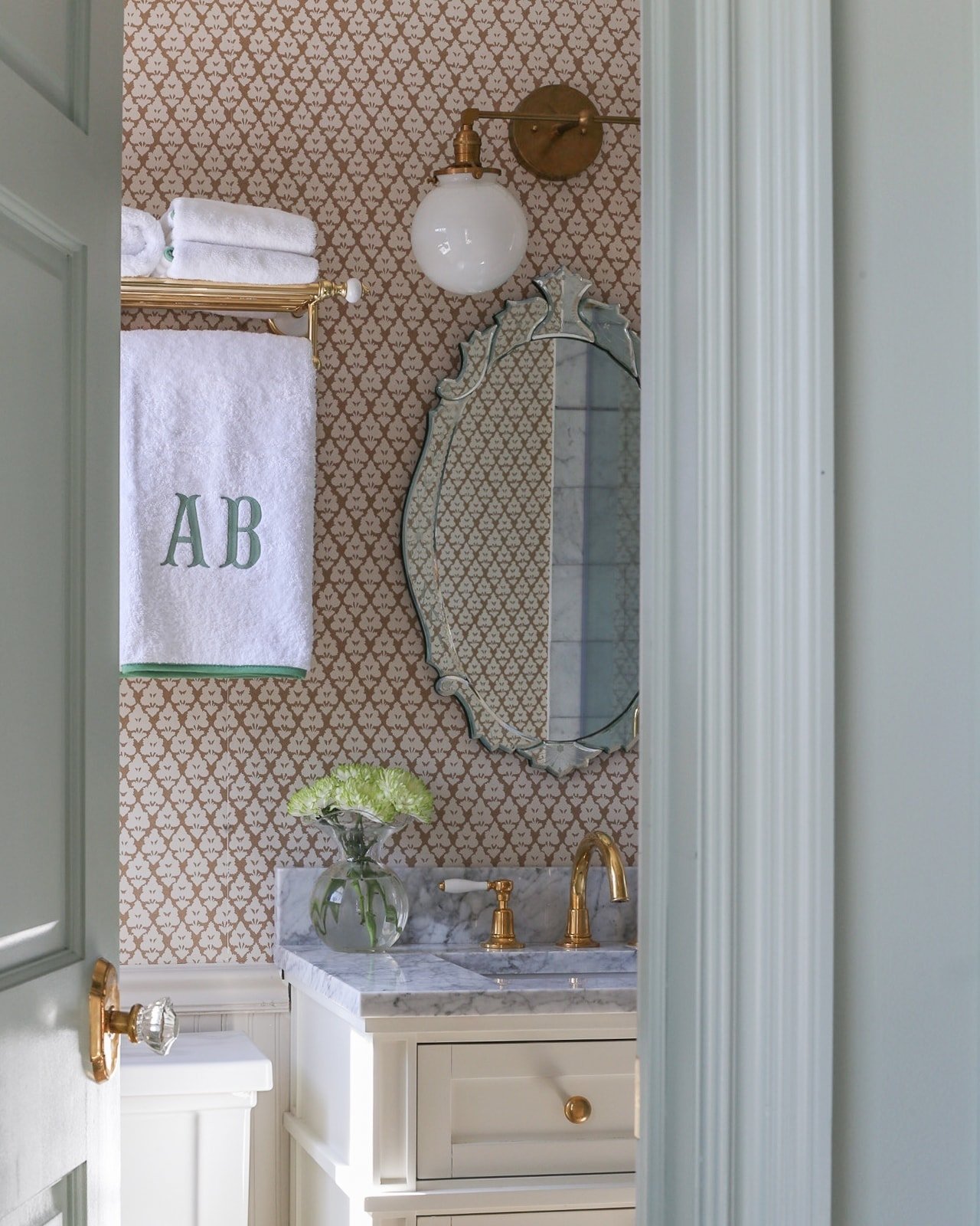 bathroom-makeover-ideas-wallpaper-monogram-towels-brass-hardware