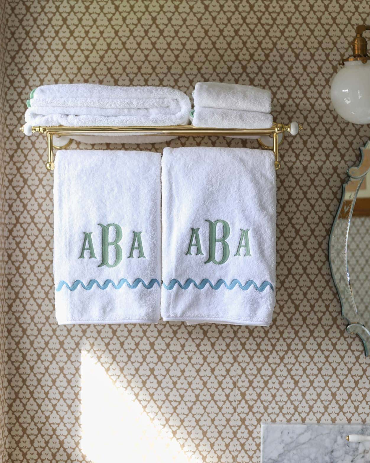 traditional-master-bathroom-design-bathroom-makeover-ideas-wallpaper-monogram-towels-brass-hardware